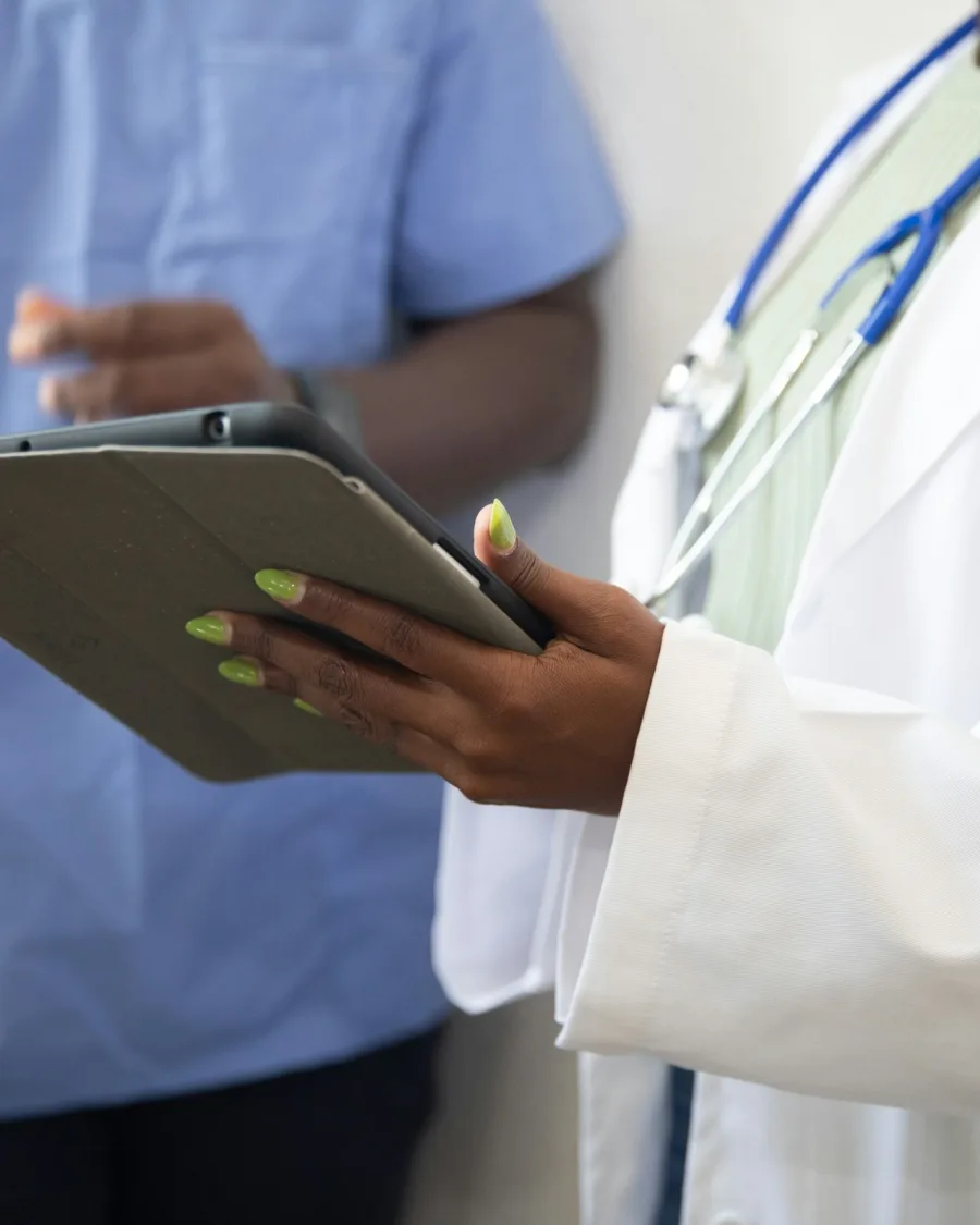 Physician reviewing an individualized NAD+ dosing plan with a patient
