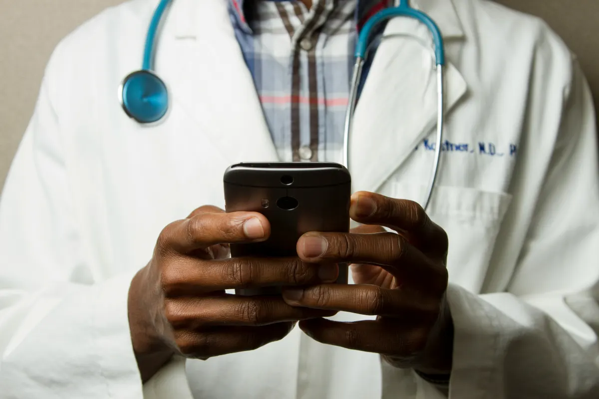 A US-licensed physician reviewing patient results on a mobile device